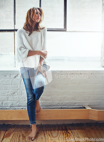 Image of Thinking, fashion and window with a woman, barefoot in her home, standing next to mockup or flare. Motivation, idea and relax with an attractive young female leaning against a wall in her house