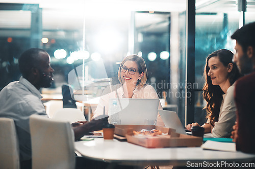 Image of Teamwork, late night and business people at workshop table with ideas, laptop and pizza at creative agency. Proposal, overtime and diversity, dinner for men and women brainstorming at startup project