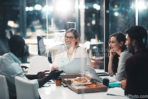 Image of Workshop, late night and marketing team in discussion at meeting with laptop and food at startup. Teamwork, overtime and diversity, business people brainstorming project at creative marketing agency.