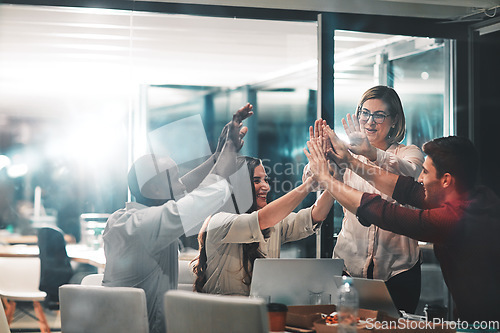 Image of High five, teamwork and business people at night celebrate stock market growth, investment profit or ipo. Diversity, trading or crypto trader excited for forex, NFT success or bitcoin mining revenue