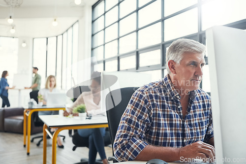 Image of Business, office building and senior man with computer working on website research, email and project. Productivity, corporate agency and elderly worker at desk for planning, schedule and strategy