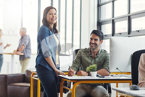 Image of Business people, happy at computer and training, team and leader help with portrait in coworking space and writing notes. Man, woman and work, collaboration and partnership with advice and coaching