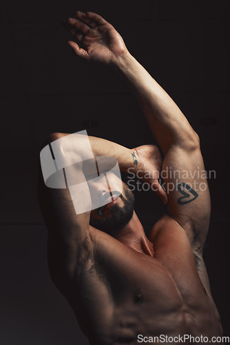 Image of Man, body or muscle on black background in studio for fitness goals, workout or training motivation and healthcare wellness check. Bodybuilder, sports athlete or model flexing on aesthetic backdrop