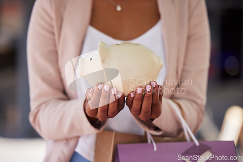 Image of Piggy bank, shopping and hands in savings account, finance and credit loan with banking, inflation or investment wealth, profit or growth. Fashion woman outdoor with shopping bag budget and investing