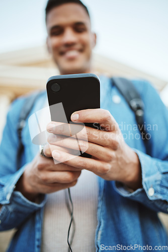 Image of Student, hands or mobile phone on university campus, college or school for exam timetable, class schedule or diploma calendar. Zoom, low angle or man on technology app for education learning research