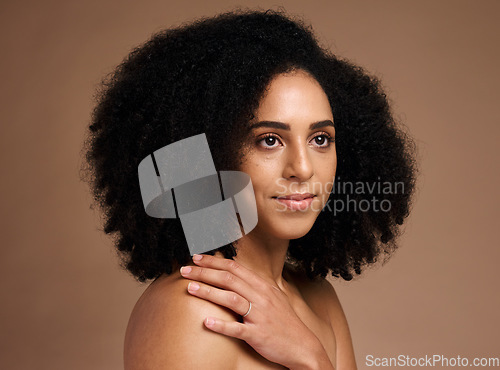 Image of Black woman, studio and thinking with beauty, makeup and cosmetic wellness with hands, skincare or afro hair. Model, soft skin glow and facial cosmetics, self care or ideas by brown studio background