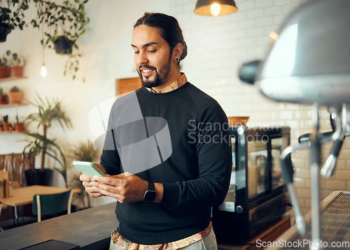 Image of Startup cafe manager or man with phone for social media, networking or company blog content review. Happy, smile or coffee shop employee with smartphone for social network, research or mobile app