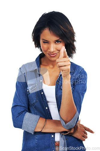 Image of Flirty, decision and portrait of a black woman pointing a finger on a white background in studio. Smile, motivation and happy African model with a wink, choice and excited on a studio background