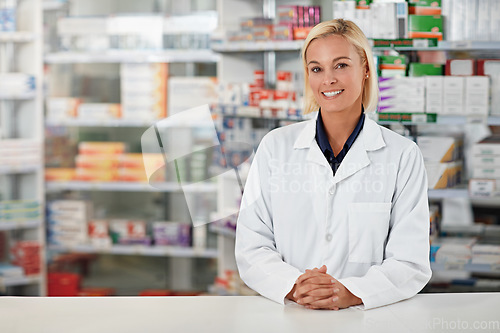 Image of Pharmacy, pharmacist and woman in portrait for medicine, product shelf and retail or healthcare industry. Trust, help desk and medical professional worker smile for inventory, stock and clinic drugs