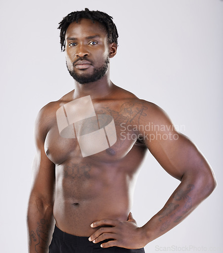 Image of Black man, fitness and portrait of sports person in studio for strong body, muscle and power. Health and wellness of a sexy male bodybuilder model with growth after exercise, workout and training