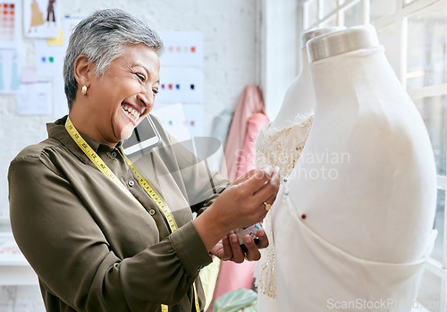 Image of Fashion, designer and phone call of woman with mannequin in workshop. Startup, smartphone and happy elderly female seamstress or tailor talking or networking with contact while sewing dress on dummy