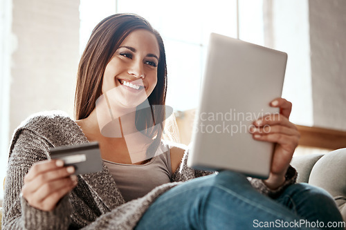 Image of Woman, online shopping and digital tablet with credit card on sofa for payment on ecommerce sale. Girl, debit card and booking online, credit score and easy purchase of convenience in a living room