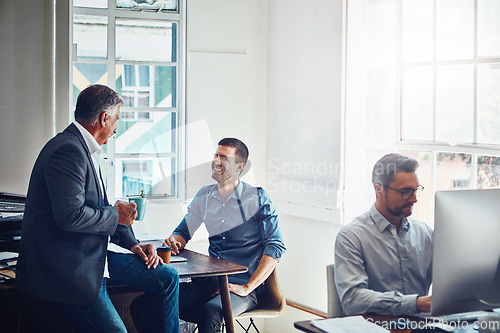 Image of Office building, meeting and business people talking at desk for planning, company success and goals. Corporate workplace, teamwork and employees sitting at table, in discussion and coworking on idea