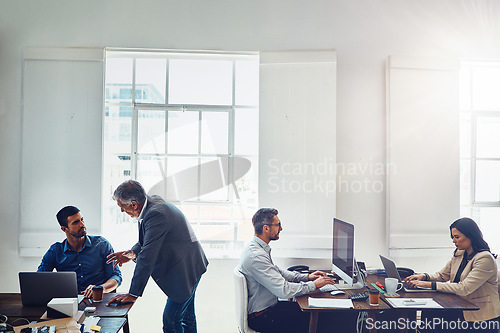 Image of Productivity, office and business people at desk working on project, planning and marketing strategy. Corporate startup, teamwork and agency staff sitting at table, typing on computer and in meeting