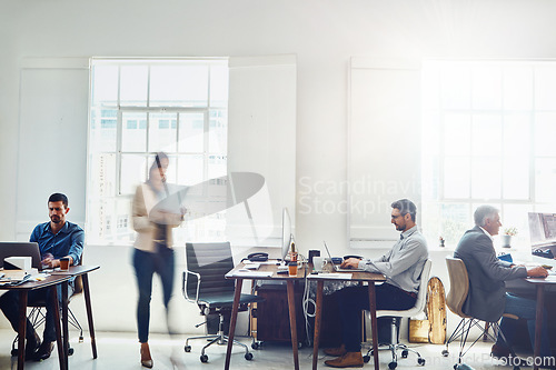 Image of Teamwork, collaboration and business people coworking in busy office workplace. Work, computers and group of employees working on tasks, targets or goals, projects or marketing strategy in company.