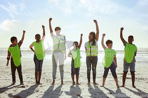 Image of Children, volunteer and beach clean up with friends standing on the sand together for eco friendly conservation. Team, nature and cleaning with kids cleaning the environment for a green earth