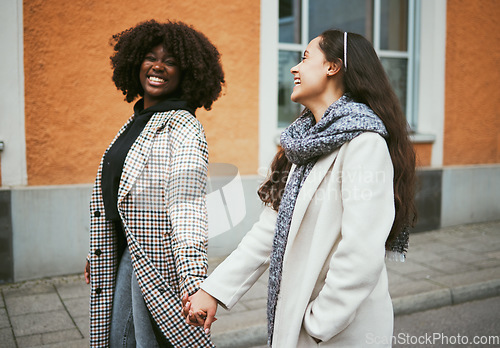 Image of Love, holding hands and lesbian couple walking in street enjoying holiday, vacation and adventure on weekend. Fashion, lgbtq relationship and women together for happy lifestyle, freedom and relaxing
