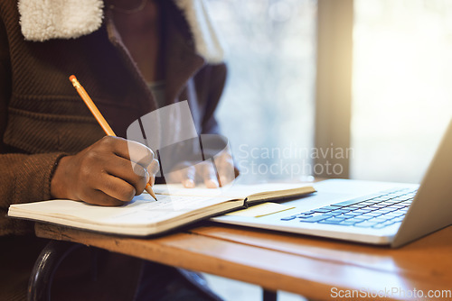 Image of Student, hands and writing in notebook, studying and learning for exams, test and creative. Black person, make notes and laptop for typing, connection and prepare for proposal, university or academic