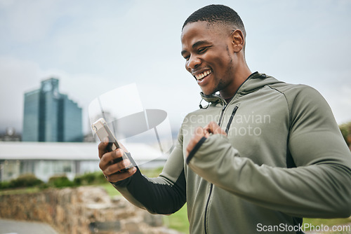 Image of Fitness, winner or black man on phone with success or winning a training, exercise or workout competition online. City, excited or healthy sports athlete happy with sponsorship deal, goals or mission