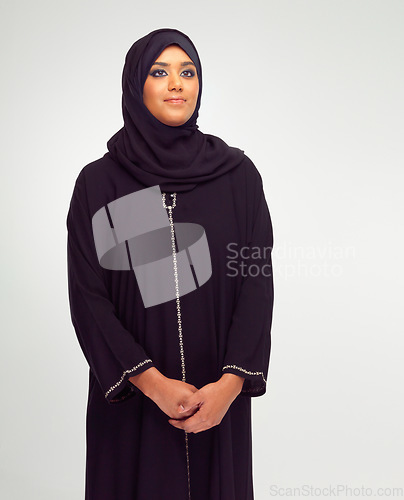 Image of Beauty, muslim and young woman in studio with a traditional, religious and modern dress. Religion, hijab and islam female model in an islamic culture outfit and headscarf isolated by white background