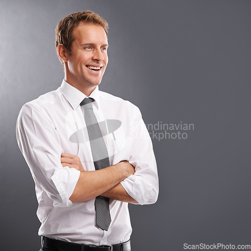 Image of Idea, vision and mindset with a business man in studio on a gray background for advertising or marketing. Thinking, growth or future mission with a handsome male employee arms crossed next to mockup