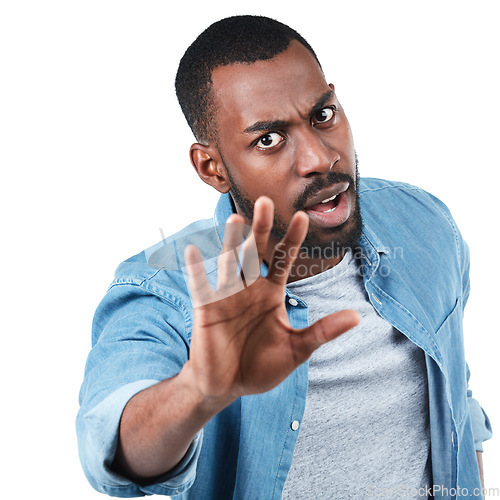 Image of Portrait, hand and man in studio for stop, sign and warning while standing against white background. Face, hand gesture and palm, protest and defense, fight and denial, no and reject while isolated