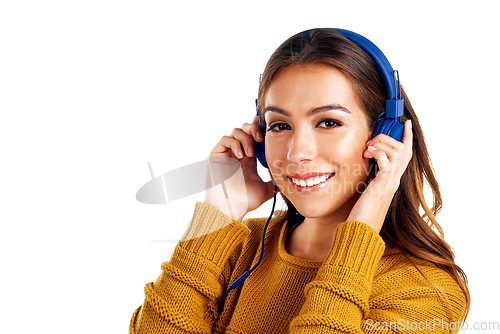 Image of Woman, portrait and headphones for music in studio, audio and streaming on white background. Face, girl and happy smile with and student relax with radio, track and playlist while standing isolated