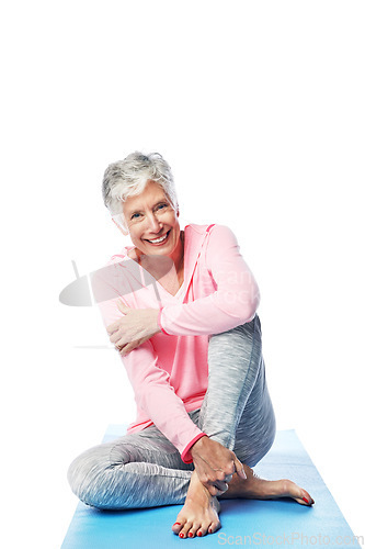 Image of Senior, yoga and portrait of woman in studio isolated on a white background. Zen chakra, pilates fitness and retired happy female from Canada sitting on mat after training and stretching for wellness