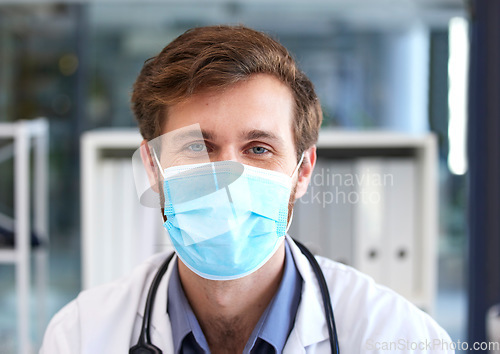 Image of Portrait, man and doctor with covid face mask in hospital for medical safety, healthcare risk and clinic analysis in Australia. Face, male surgeon and corona virus expert, ppe compliance and medicine