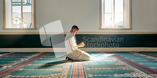 Image of Muslim pray, hope or hands in prayer on carpet for peace, gratitude or support to Allah in holy temple or mosque. Trust, Islamic or spiritual person praying to worship God on Ramadan Kareem in Qatar