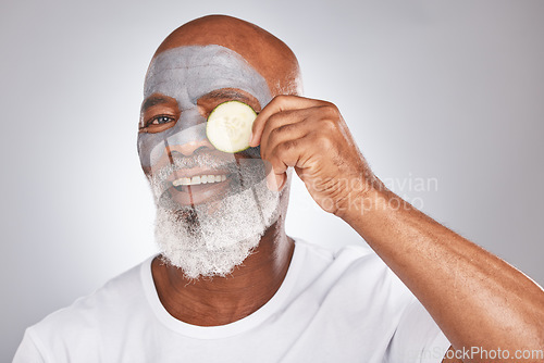 Image of Skincare, face mask or happy old man with cucumber marketing or advertising natural vegan diet for glowing skin. Cream, portrait, senior black man with beauty or healthy anti aging facial cosmetics