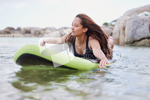 Image of Fitness, surfer woman surfing in ocean with surfboard, swimwear and peace with sport outdoor and nature. Beach, exercise and young female, surf on waves with adventure and extreme sports on holiday