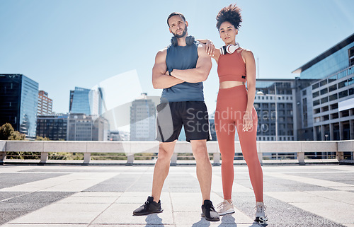 Image of Black couple, outdoor training portrait and headphones for support, motivation and workout in city. Exercise, couple teamwork and goals for health, wellness and development with music by buildings