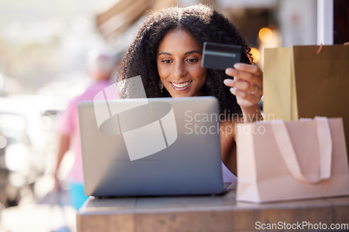 Image of Credit card, laptop and woman in city online shopping, e commerce and fintech for fashion marketing, advertising and promotion sales. Black woman on digital e commerce website for finance banking app