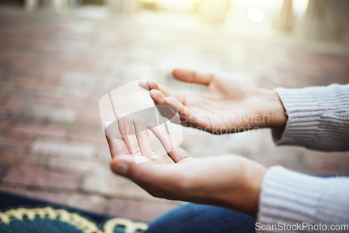 Image of Hands, praying and religion with a man muslim prayer to God in faith or devotion in islamic worship during eid or ramadan. Islam, trust or mosque with an arabic male in a temple to pray while fasting