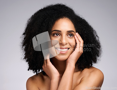 Image of Black woman, beauty and face skincare with a smile, glow and happiness for clean skin on grey studio background. Aesthetic model with afro hair and dermatology, cosmetic and makeup for facial results