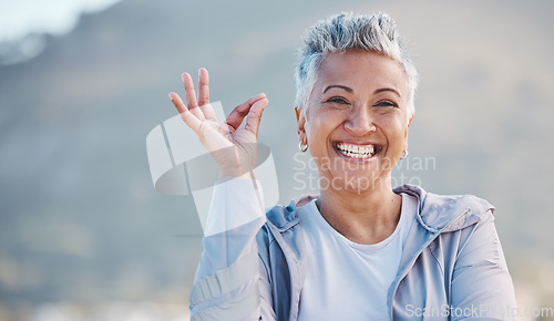 Image of Elderly woman, portrait and OK hand in nature for exercise, training or workout success, trust and healthy lifestyle promotion. Yes sign, happy and retirement old woman for sports or wellness journey