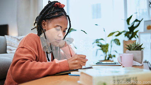 Image of Student, education and black woman with books for studying, learning and notes in academic class. University, college and female focus at desk doing homework, assignment and school project at home