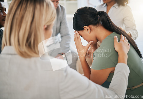 Image of Grief, loss and woman at community support group for mental health, counseling or help. Solidarity, trust and group of people in circle comforting, helping and supporting lady with bad news together.