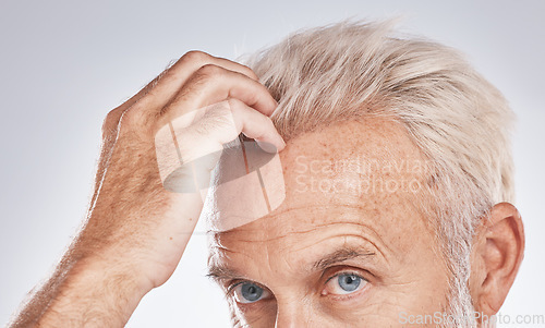 Image of Beauty, thinking and senior man with hair care cosmetic treatment for blonde texture check. Half face of mature caucasian hair model grooming hairstyle textures in gray studio background.