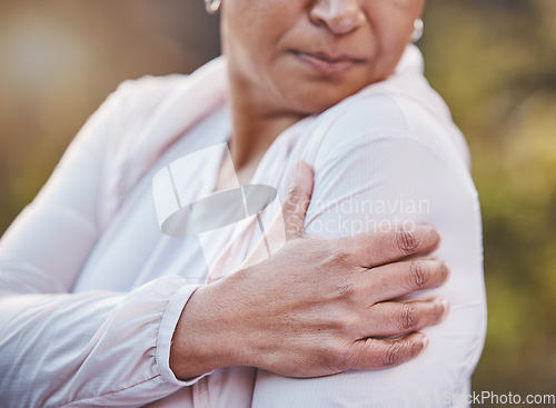 Image of Senior woman, sports injury and shoulder pain at park after accident. Wellness, health and hand of elderly female on arm with muscle inflammation or fibromyalgia after exercise or training outdoors.