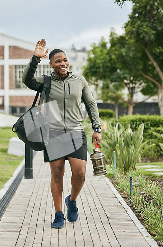 Image of Fitness, happy or black man walking to gym and wave for training, exercise or workout with a duffle bag in Miami, Florida. Smile, traveling or healthy sports athlete with goals, motivation or pride