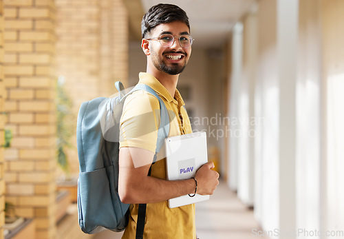 Image of College student portrait, happy man and walking at university with a tablet and backpack to study and learn. Gen z male happy about education, learning and future after studying at school building