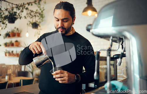 Image of Cafe, kitchen worker and coffee shop machine for coffee espresso in a restaurant. Waiter, milk foam and morning cream latte with a store manager working on hot drink order service as barista