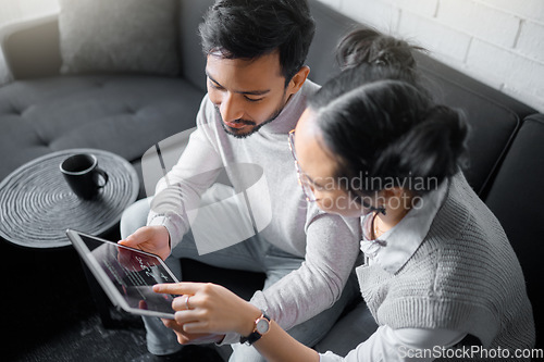 Image of Tablet, sofa and couple with smart home technology for thermostat heating, apartment security network or house automation. AI software, digital app monitor and people with interactive IOT electronics