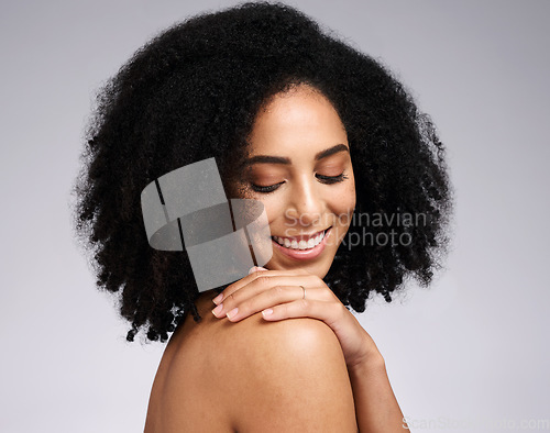 Image of Body care, wellness and happy black woman in a studio with a beauty, soft and natural skin routine. Skincare, self love and African female model with a cosmetic self care treatment by gray background