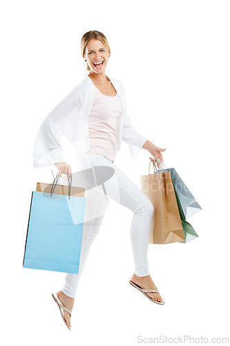 Image of Happy woman jump with bag from shopping, fashion and retail, customer in air isolated on white background. Smile in portrait, luxury designer brand and clothes, gift and discount sale with freedom
