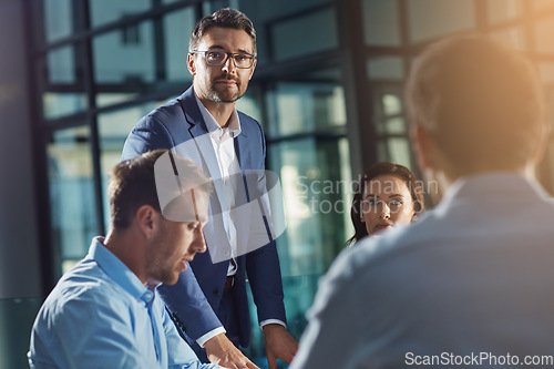 Image of Business people, man and portrait at meeting in office, planning or strategy for teamwork, vision and leader. Businessman, leadership and team at desk with woman, collaboration and team building