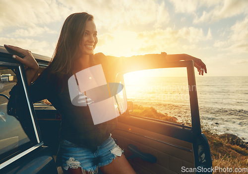 Image of Road trip, car and sunset woman by ocean for travel, journey or happy summer vacation in nature. Retro, vintage and gen z driver, person or youth by sea, river or lake for outdoor adventure and smile