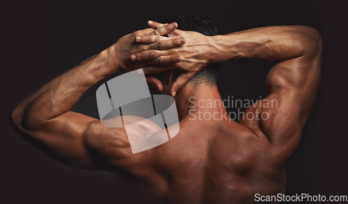 Image of Man, body or back muscle on black background in studio fitness goals, workout or training motivation and healthcare wellness check. Bodybuilder, sports athlete or model flexing on aesthetic backdrop